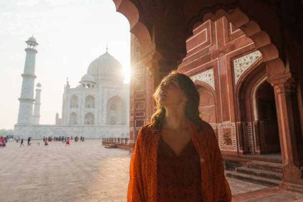 istock Woman exploring Taj Mahal at sunrise, India 2202349528