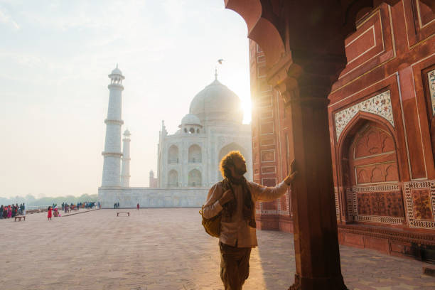 istock Man exploring Taj Mahal during trip to India 2202349531