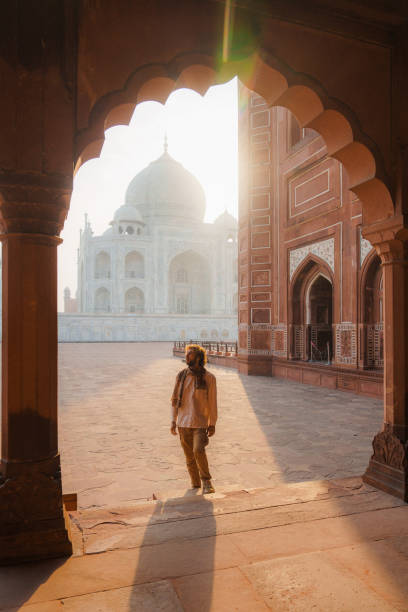 istock Man exploring Taj Mahal during trip to India 2202349810