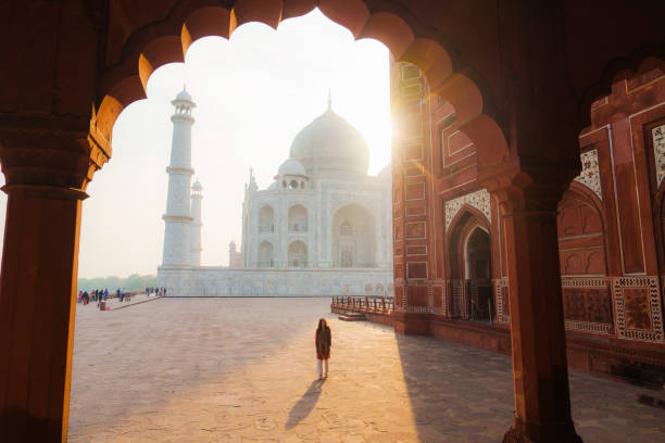 istock Woman exploring Taj Mahal at sunrise, India 2202349844