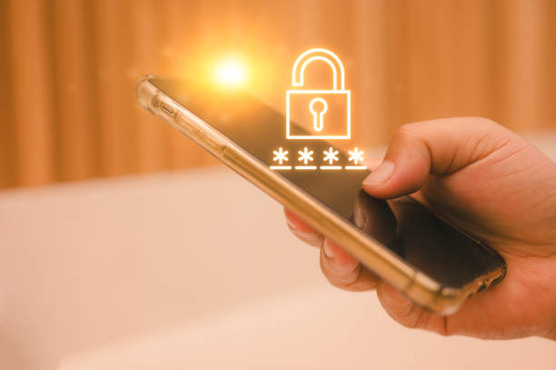 Businessman hand holding smartphone with security key lock icon on the device screen. Privacy protection, internet and mobile security concept