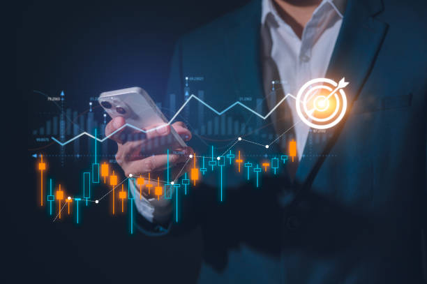 istock Businessman using smartphone analyzing trading graph financial data. Business finance background.business finance technology and investment concept. Stock Market Investment Fund and Digital Asset 2202359298