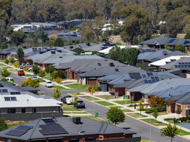 Suburban houses close together The rooftops of suburban houses close together - Albury NSW solar panels on the roof of building in a city stock pictures, royalty-free photos & images