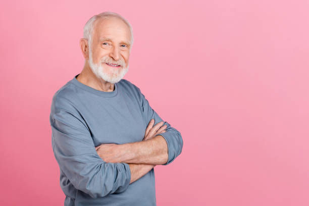 istock Photo of charming confident guy pensioner dressed grey pullover arms folded empty space isolated pink color background 2202360957