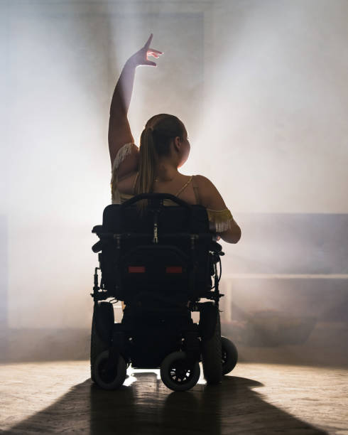 istock Woman practicing and performing a freestyle wheelchair dance at a dancing studio 2202363772