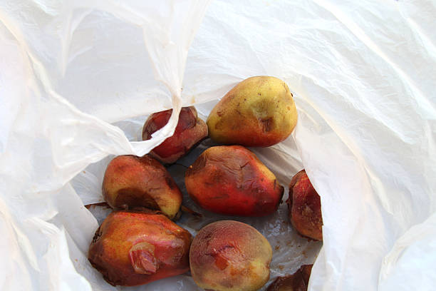 istock Overripe, already rotten pears lie in a white bag 2202367817