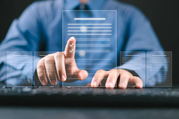 istock Businessman checking the steps through document with a list of checkboxes ,regulation ,Concepts of practices and policies , procedure company articles of association Terms and Conditions 2202374703