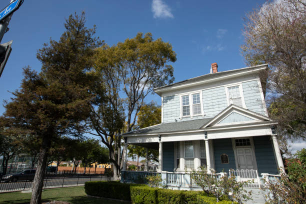 Los Angeles, CA - November 16, 2025: A house with a beautiful tree out front in Beverly Hills.
