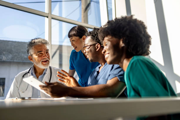istock Diverse Healthcare Team Collaborating in Modern Office Setting 2202380506