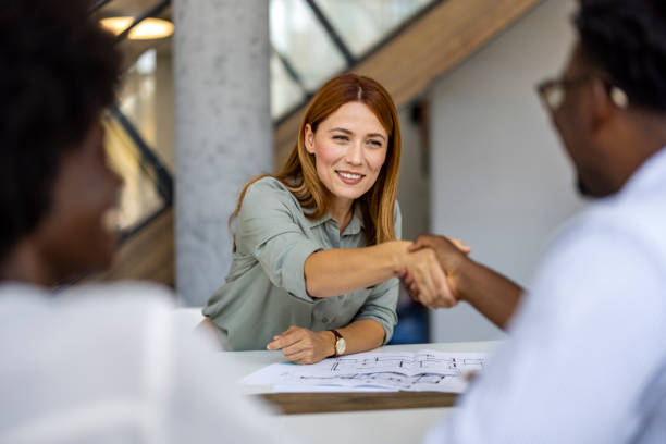 istock Business Professionals Meeting and Shaking Hands in Modern Office 2202380558