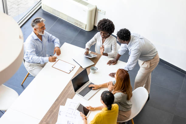 istock Diverse Team Collaborating in Modern Office Meeting 2202380559