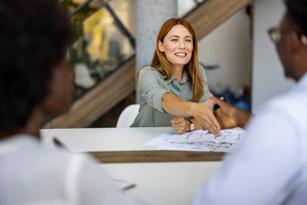 istock Friendly Business Meeting With Professional Handshake and Discussion 2202380561