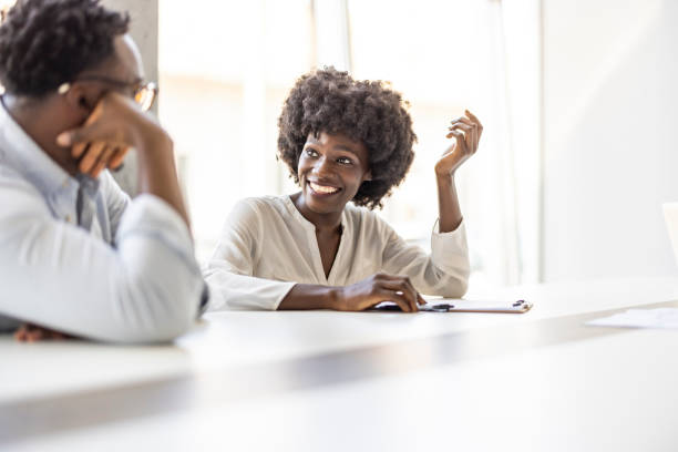 istock Friendly Office Meeting With Smiling Colleagues in Modern Workspace 2202380615