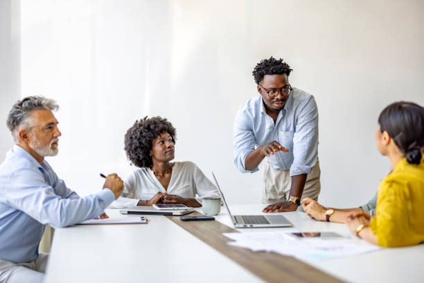 istock Diverse Team Engaging in a Collaborative Business Meeting 2202380634