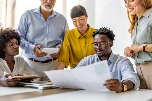 istock Diverse Business Team Collaborating On Project In Modern Office 2202380694