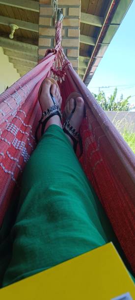 istock Relaxing in a colorful hammock 2202386068