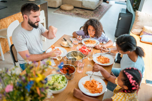 istock Fusion Family Eating Experience in a Cozy Setting 2202393997