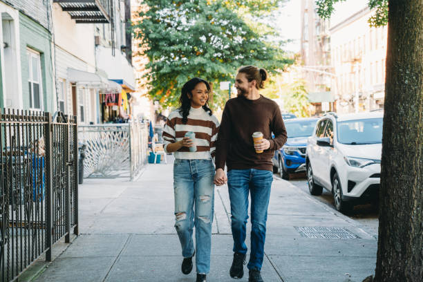 istock A millennial couple is walking together in Brooklyn 2202396220