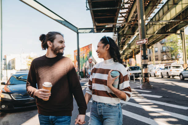 istock A millennial couple is walking together in Brooklyn 2202396227