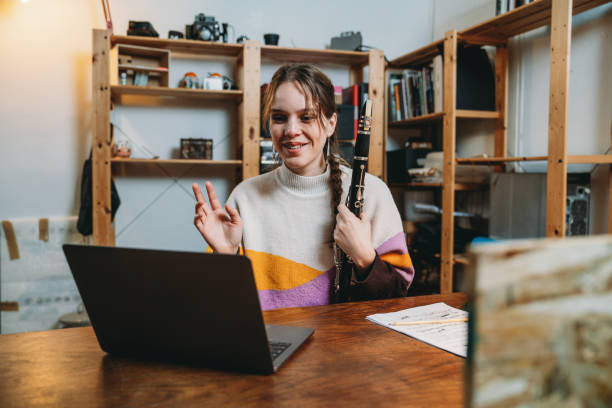 istock A clarinet player is doing a video call to practice with colleagues 2202396290