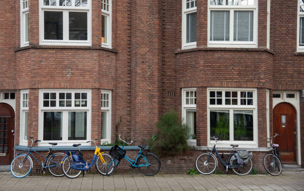 istock Bicycles parked in front of a traditional dutch brick building 2202397921