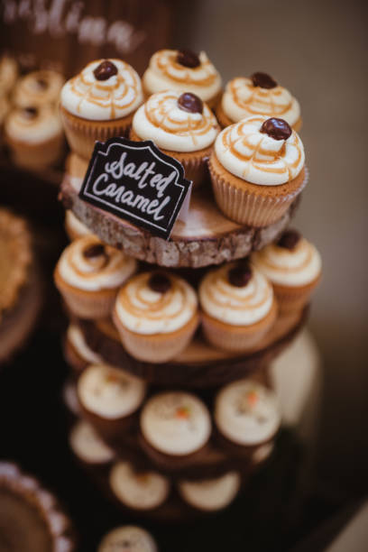 Salted caramel cupcakes on tiered tray at wedding reception