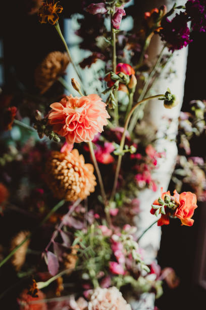 istock Flower arrangement on birch tree branch at wedding ceremony 2202413091