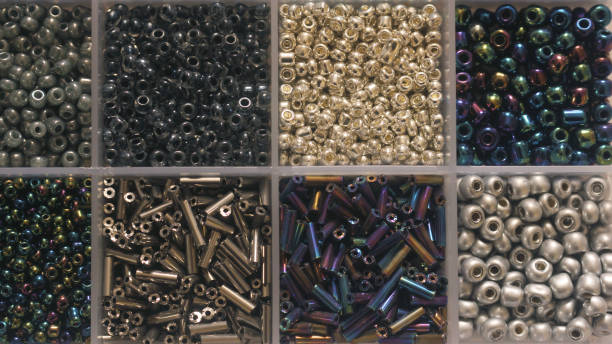 istock Black and Gray Colored Seed Beads in Container For Jewelry Making 2202414022