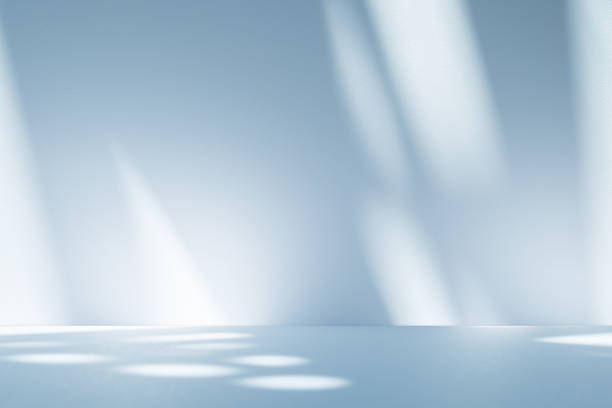 istock Studio style background wall decoration presentation uses white and blue tones. with shadows cast from a nearby window, concept creating a decorative 2202414100