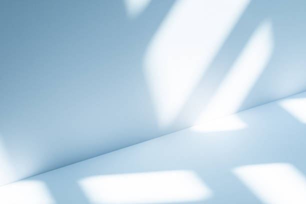 istock Studio style background wall decoration presentation uses white and blue tones. with shadows cast from a nearby window, concept creating a decorative 2202414118
