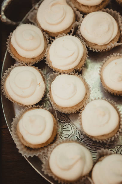 istock Top down photo of vanilla cupcakes with icing 2202414998