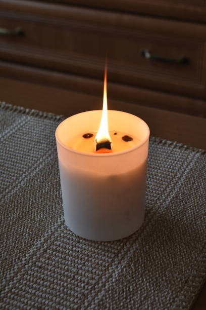 istock The yellow flame of a burning candle 2202417840