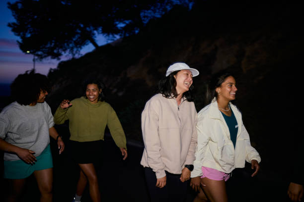 istock Group of Gen Z runners, running together at night 2202418716