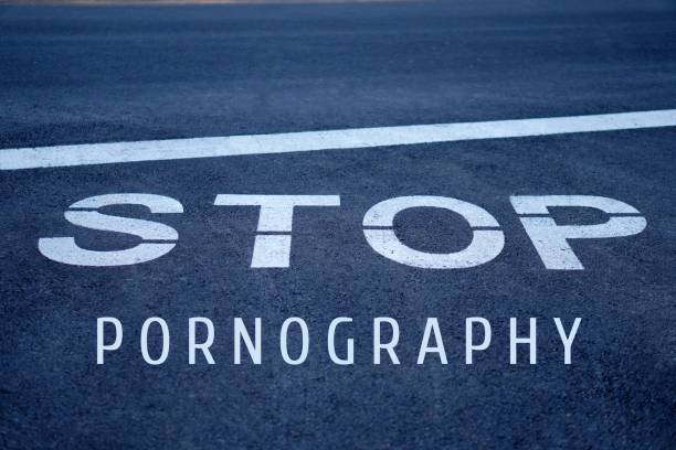 istock stop pornography concept. words written on the asphalt. 2202430557