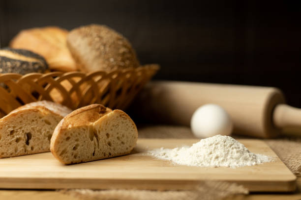 Sliced bread, flour, egg on the table. The process of making bread. Fresh pastries. High quality photo