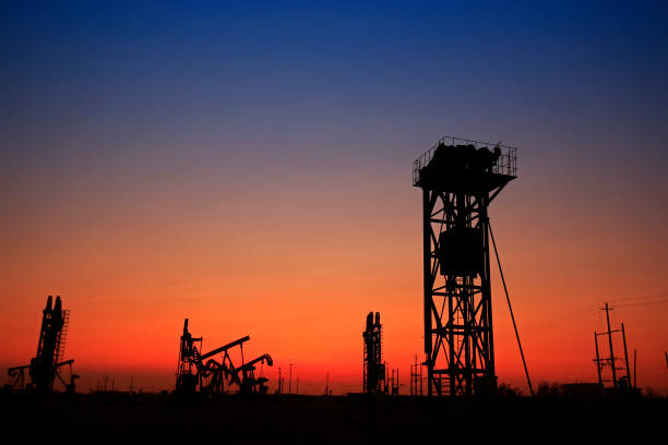 Classic retro Oil pump under the stars on the mountain with illuminated Synechka Oil  gas production in Ukraine an old ancient method of producing hydrocarbons  chemical raw materials