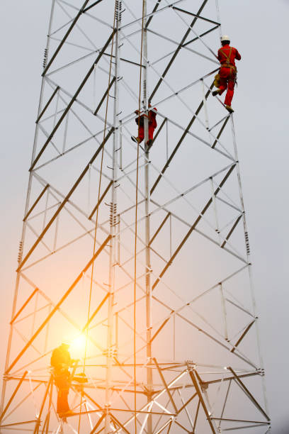 istock The workers of the pylon 2202433748