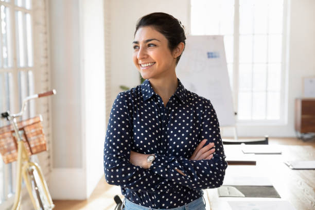 istock Young Indian businesswoman posing in modern creative office 2202436766