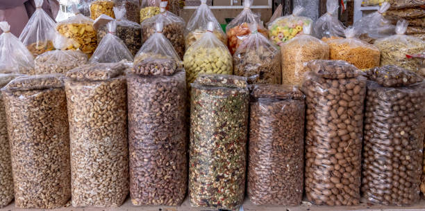 istock Assorted nuts for sale in the market 2202438325