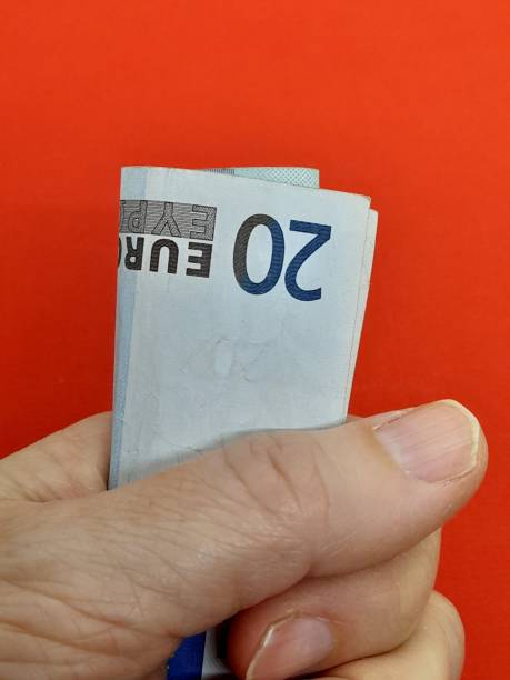 istock Euro money with hand. 2202440352