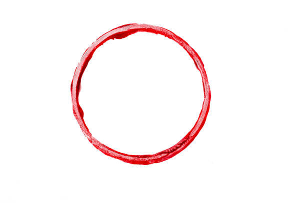 A single red circular paint imprint with a rough, textured edge on a white background. The bold color and irregular shape create a dynamic and artistic visual, symbolizing creativity, spontaneity, and abstract expression.
