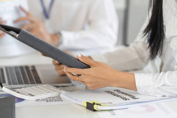 istock Financial advisor presenting strategic planning documents in a business meeting, enhancing client understanding. 2202445843