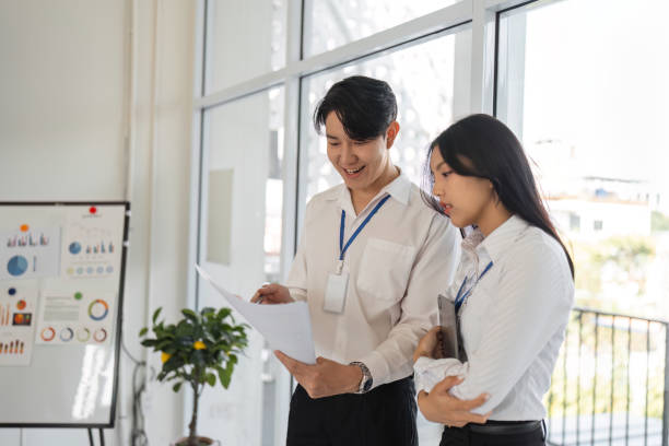 istock Team members reviewing tax documents and sharing insights 2202446226