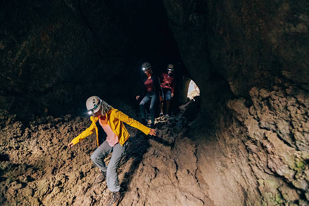 Group of Adventurers Exploring a Dark Cave