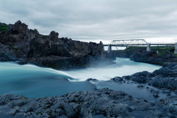 istock River canyon with steel bridge and misty waters 2202448266