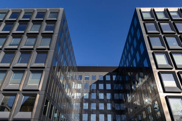 istock Modern building facade with large glass windows. Business office background 2202448579