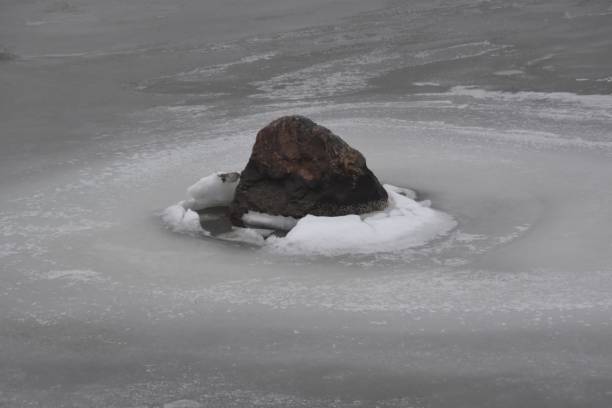 istock A Stone In Frozen Water 2202449726