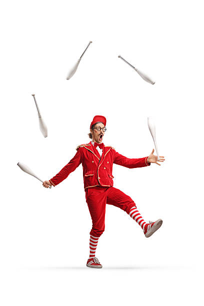istock Entertainer in a red suit juggling 2202450511