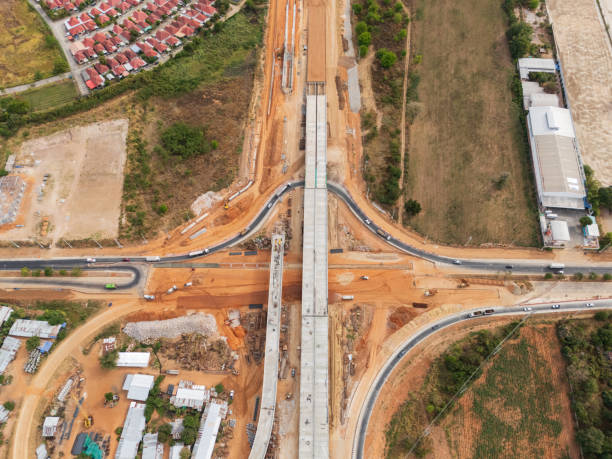 istock The construction site before the construction of the concrete bridge over the intersection by crane workers, tractors, and backhoes 2202454199