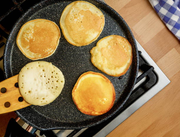 istock Delicious and Fluffy Pancakes Cooking in a pan 2202455560